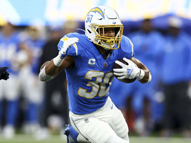 INGLEWOOD, CA - OCTOBER 29: Austin Ekeler #30 of the Los Angeles Chargers carries the ball during the first quarter of an NFL football game against the Chicago Bears at SoFi Stadium on October 29, 2023 in Inglewood, California.