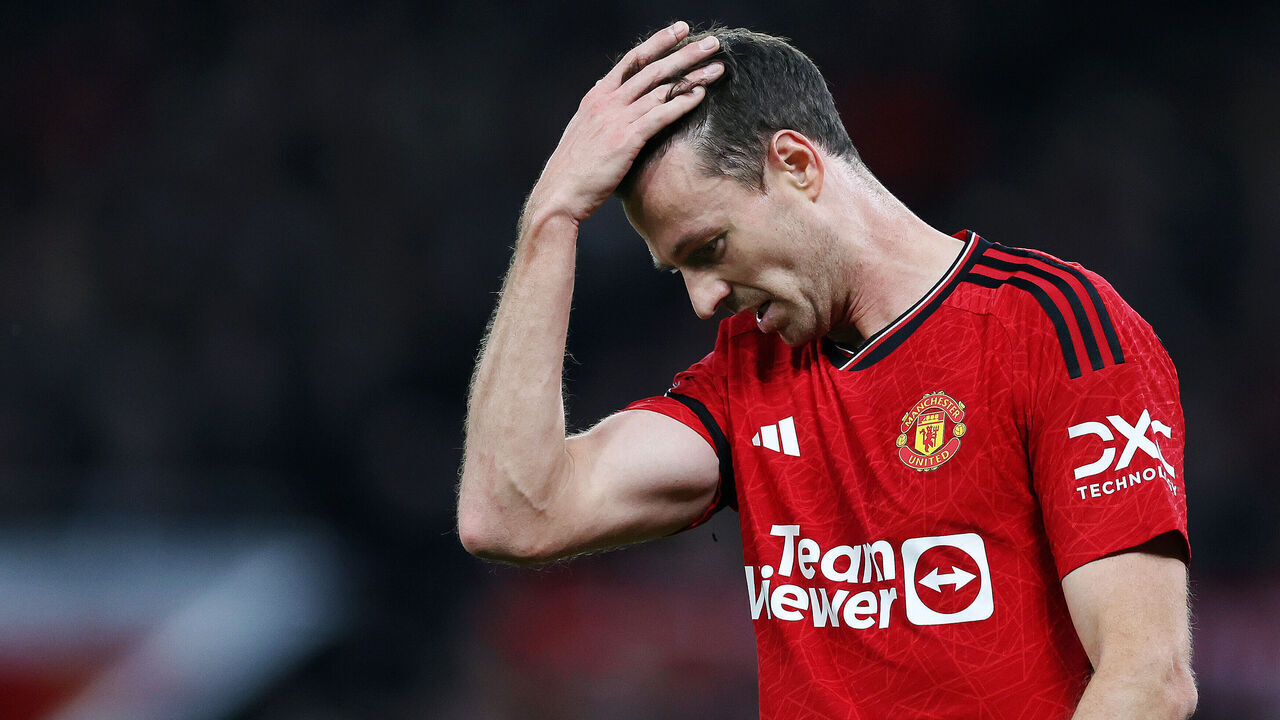 MANCHESTER, ENGLAND - OCTOBER 29: Jonny Evans of Manchester United looks dejected after Erling Haaland of Manchester City (not pictured) scores his team's second goal during the Premier League match between Manchester United and Manchester City at Old Trafford on October 29, 2023 in Manchester, England.