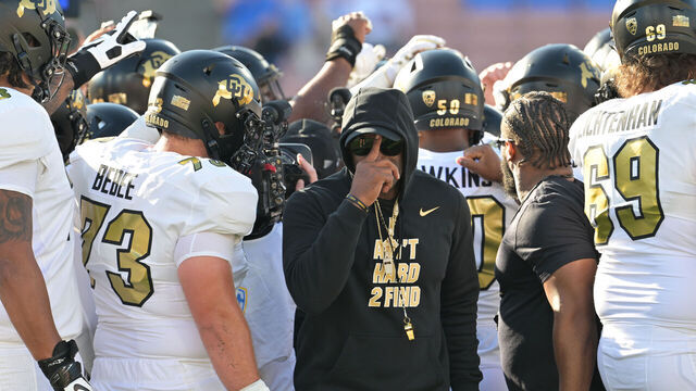 PASADENA, CALIFORNIA - OCTOBER 28: Head Coach Deion Sanders turns around after talking with his player during warmups as they get ready to take on the UCLA Bruins at Rose Bowl Stadium on October 28, 2023 in Pasadena, California.