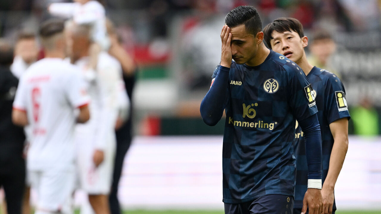 AUGSBURG, GERMANY - SEPTEMBER 23: Anwar El Ghazi and Lee Jae-Song of 1.FSV Mainz 05 look dejected following the team's loss during the Bundesliga match between FC Augsburg and 1. FSV Mainz 05 at WWK-Arena on September 23, 2023 in Augsburg, Germany.