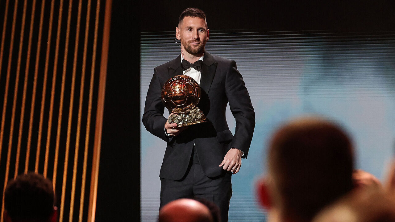 Inter Miami CF's Argentine forward Lionel Messi holds his trophy on stage as he receives his 8th Ballon d'Or award during the 2023 Ballon d'Or France Football award ceremony at the Theatre du Chatelet in Paris on October 30, 2023.