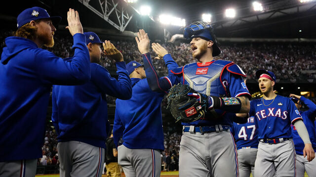 PHOENIX, AZ - OCTOBER 30: Jonah Heim #28 of the Texas Rangers celebrates with teammates after their win in Game 3 of the 2023 World Series between the Texas Rangers and the Arizona Diamondbacks at Chase Field on Monday, October 30, 2023 in Phoenix, Arizona. The Rangers defeated the Diamondbacks 3-1 to lead the series 2-1.