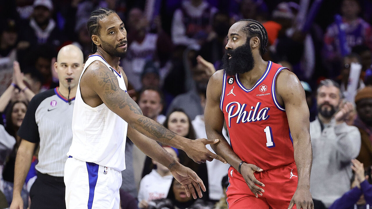 PHILADELPHIA, PENNSYLVANIA - DECEMBER 23: Kawhi Leonard #2 of the LA Clippers and James Harden #1 of the Philadelphia 76ers speak during the fourth quarter at Wells Fargo Center on December 23, 2022 in Philadelphia, Pennsylvania.