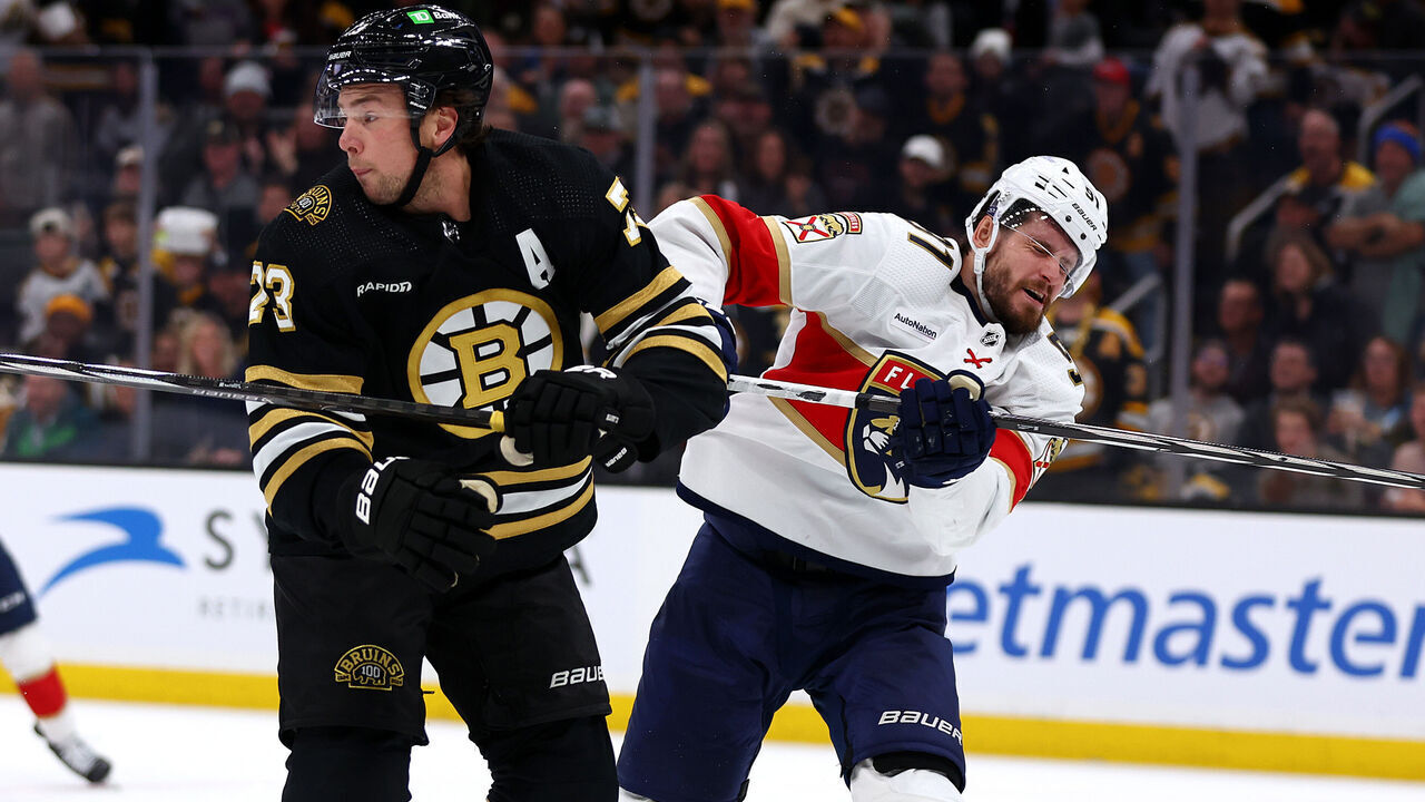 BOSTON, MASSACHUSETTS - OCTOBER 30: Charlie McAvoy #73 of the Boston Bruins commits an illegal check to the head against Oliver Ekman-Larsson #91 of the Florida Panthers during the third period at TD Garden on October 30, 2023 in Boston, Massachusetts.