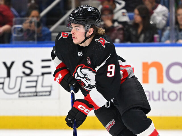 BUFFALO, NEW YORK - OCTOBER 29: Zach Benson #9 of the Buffalo Sabres controls the puck against Mikko Rantanen #96 of the Colorado Avalanche during an NHL game on October 29, 2023 at KeyBank Center in Buffalo, New York.