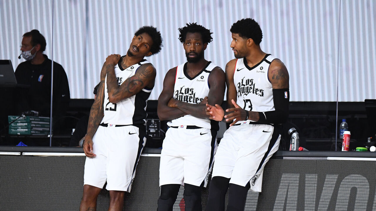 ORLANDO, FL - SEPTEMBER 7: Lou Williams #23 of the LA Clippers, Patrick Beverley #21 of the LA Clippers, and Paul George #13 of the LA Clippers talk on the sidelines during a game against the Denver Nuggets during Round Two, Game Three of the Western Conference Semifinals on September 7, 2020 at the AdventHealth Arena at ESPN Wide World Of Sports Complex in Orlando, Florida. NOTE TO USER: User expressly acknowledges and agrees that, by downloading and/or using this Photograph, user is consenting to the terms and conditions of the Getty Images License Agreement. Mandatory Copyright Notice: Copyright 2020 NBAE