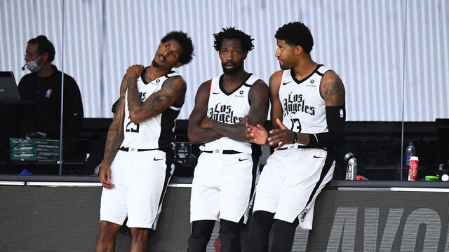 ORLANDO, FL - SEPTEMBER 7: Lou Williams #23 of the LA Clippers, Patrick Beverley #21 of the LA Clippers, and Paul George #13 of the LA Clippers talk on the sidelines during a game against the Denver Nuggets during Round Two, Game Three of the Western Conference Semifinals on September 7, 2020 at the AdventHealth Arena at ESPN Wide World Of Sports Complex in Orlando, Florida. NOTE TO USER: User expressly acknowledges and agrees that, by downloading and/or using this Photograph, user is consenting to the terms and conditions of the Getty Images License Agreement. Mandatory Copyright Notice: Copyright 2020 NBAE