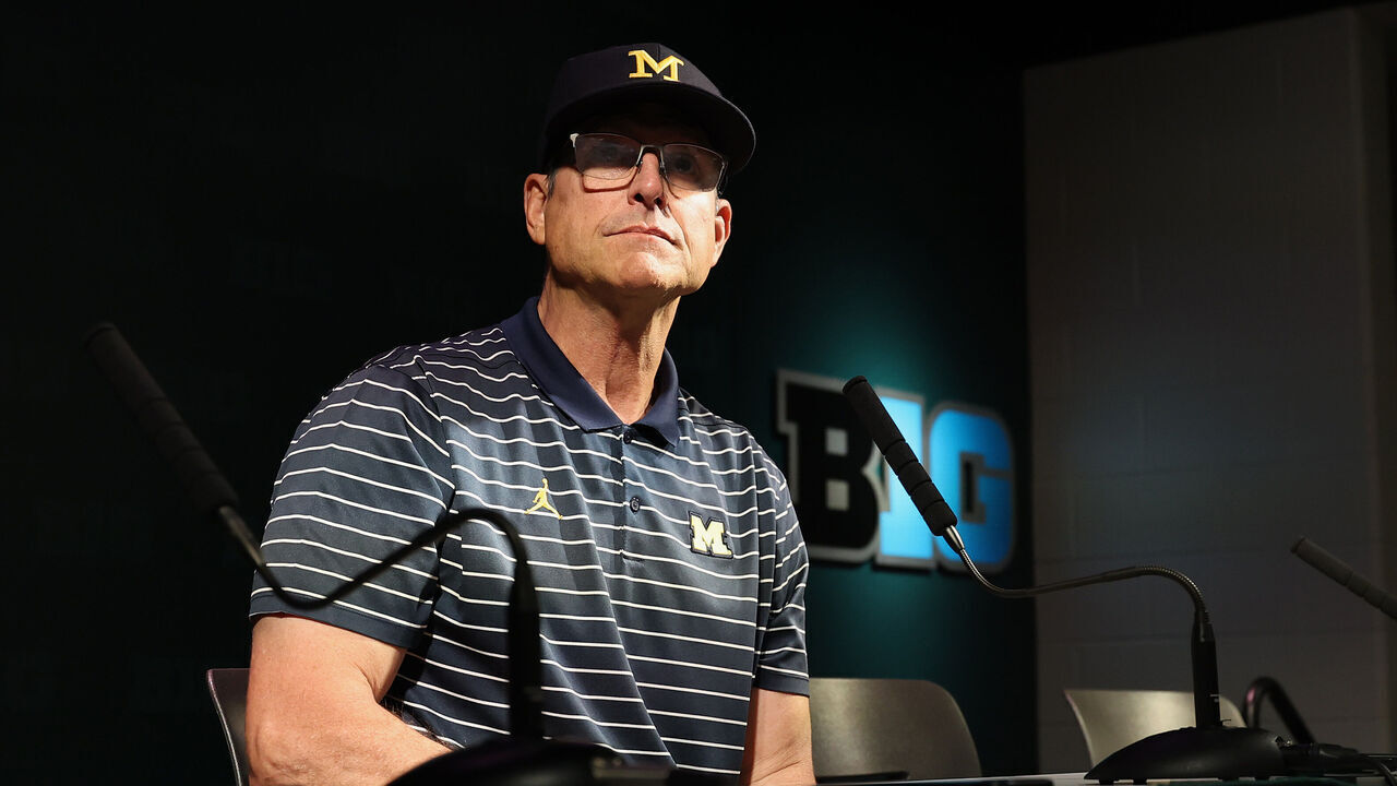 EAST LANSING, MICHIGAN - OCTOBER 21: Head coach Jim Harbaugh of the Michigan Wolverines talks to the media after a 49-0 win over the Michigan State Spartans at Spartan Stadium on October 21, 2023 in East Lansing, Michigan.