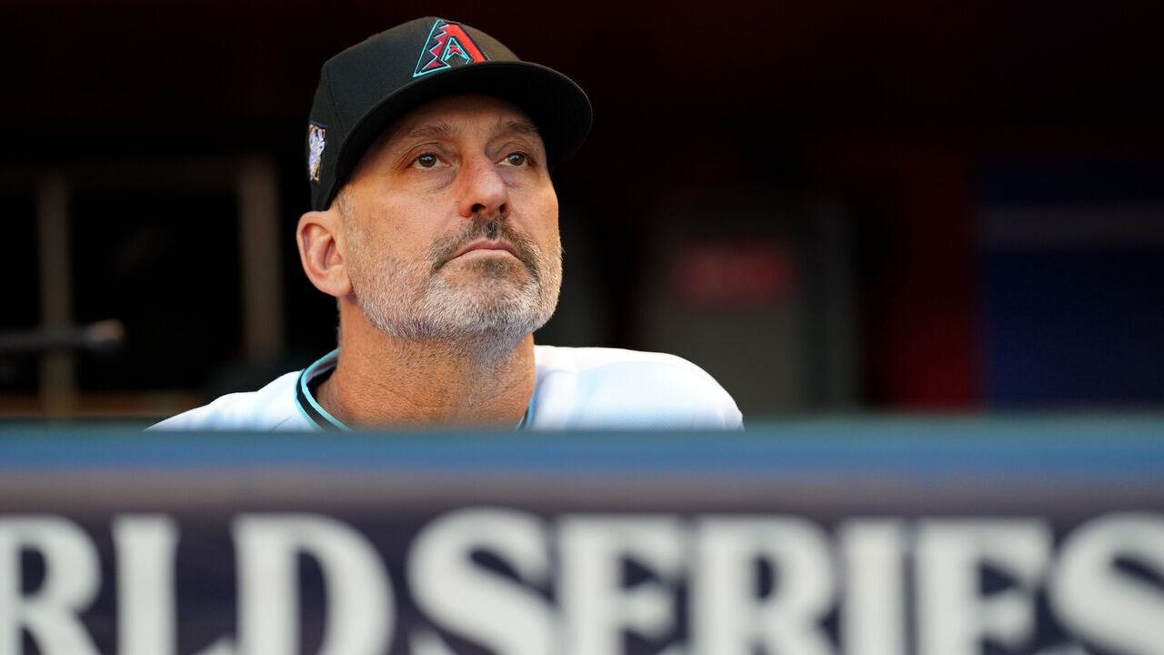 PHOENIX, AZ - OCTOBER 30: Manager Torey Lovullo #17 of the Arizona Diamondbacks looks on from the dugout prior to Game 3 of the 2023 World Series between the Texas Rangers and the Arizona Diamondbacks at Chase Field on Monday, October 30, 2023 in Phoenix, Arizona.