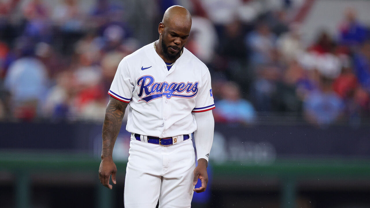 ARLINGTON, TEXAS - OCTOBER 18: Adolis Garcia #53 of the Texas Rangers walks back to the dugout after an out to end the eighth inning against the Houston Astros in Game Three of the American League Championship Series at Globe Life Field on October 18, 2023 in Arlington, Texas.