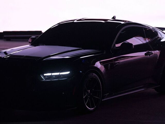 A 2024 Ford Mustang Dark Horse sits on stage during its debut at the North American International Auto Show in Detroit, Michigan on September 14, 2022.