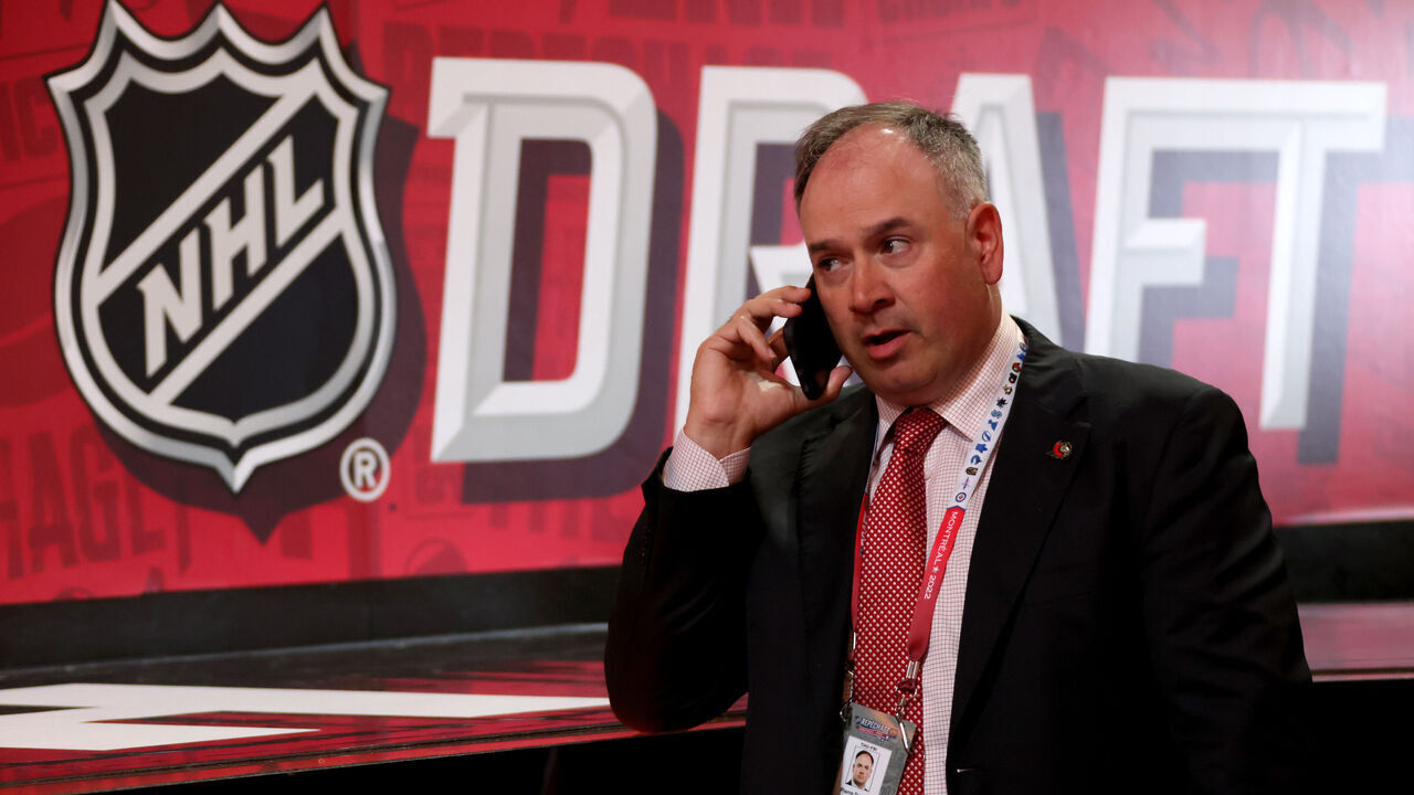 MONTREAL, QUEBEC - JULY 08: General manager Pierre Dorion of the Ottawa Senators talks on his phone during the 2022 Upper Deck NHL Draft at Bell Centre on July 08, 2022 in Montreal, Quebec.