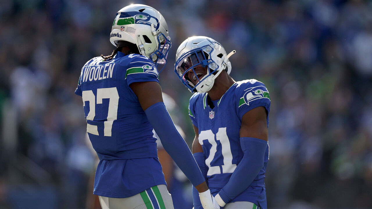 SEATTLE, WASHINGTON - OCTOBER 29: Riq Woolen #27 and Devon Witherspoon #21 of the Seattle Seahawks react during the second quarter against the Cleveland Browns at Lumen Field on October 29, 2023 in Seattle, Washington.