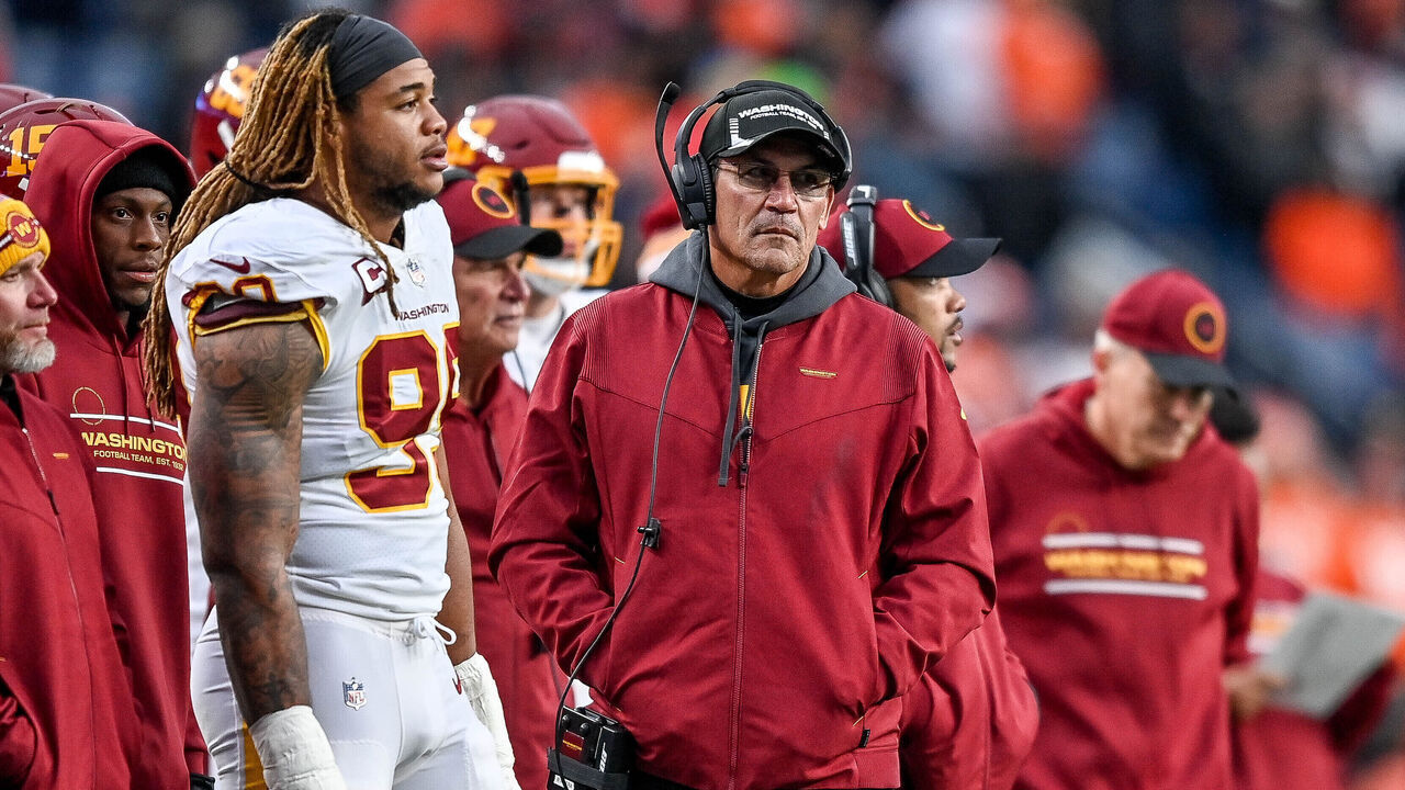 DENVER, CO - OCTOBER 31: Washington Football Team head coach Ron Rivera looks on as defensive end Chase Young (99) stands on the sideline during a game between the Denver Broncos and the Washington Football Team at Empower Field at Mile High on October 31, 2021 in Denver, Colorado.