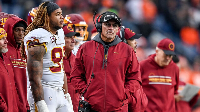 DENVER, CO - OCTOBER 31: Washington Football Team head coach Ron Rivera looks on as defensive end Chase Young (99) stands on the sideline during a game between the Denver Broncos and the Washington Football Team at Empower Field at Mile High on October 31, 2021 in Denver, Colorado.