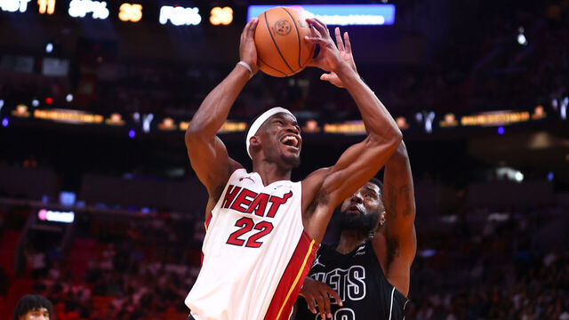 MIAMI, FLORIDA - NOVEMBER 01: Jimmy Butler #22 of the Miami Heat drives to the basket against Royce O'Neale #00 of the Brooklyn Nets during the second quarter of the game at Kaseya Center on November 01, 2023 in Miami, Florida.