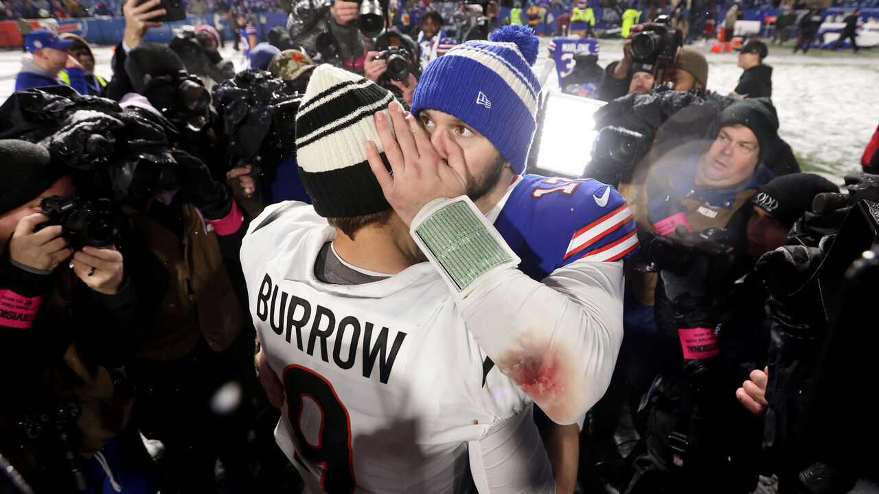 ORCHARD PARK, NEW YORK - JANUARY 22: Josh Allen #17 of the Buffalo Bills talks with Joe Burrow #9 of the Cincinnati Bengals after the AFC Divisional Playoff game at Highmark Stadium on January 22, 2023 in Orchard Park, New York. The Cincinnati Bengals defeated the Buffalo Bills with a score of 27 to 10.