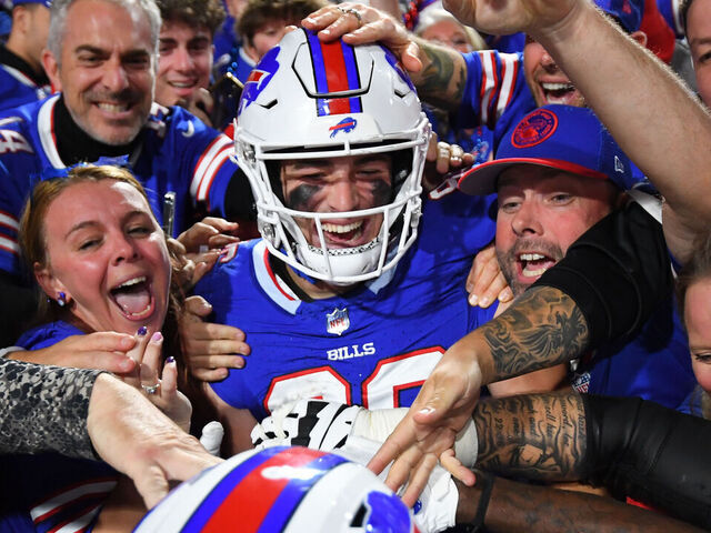 ORCHARD PARK, NEW YORK - OCTOBER 26: Dalton Kincaid #86 of the Buffalo Bills celebrates his touchdown with teammates and fans against the Tampa Bay Buccaneers during the first half at Highmark Stadium on October 26, 2023 in Orchard Park, New York.