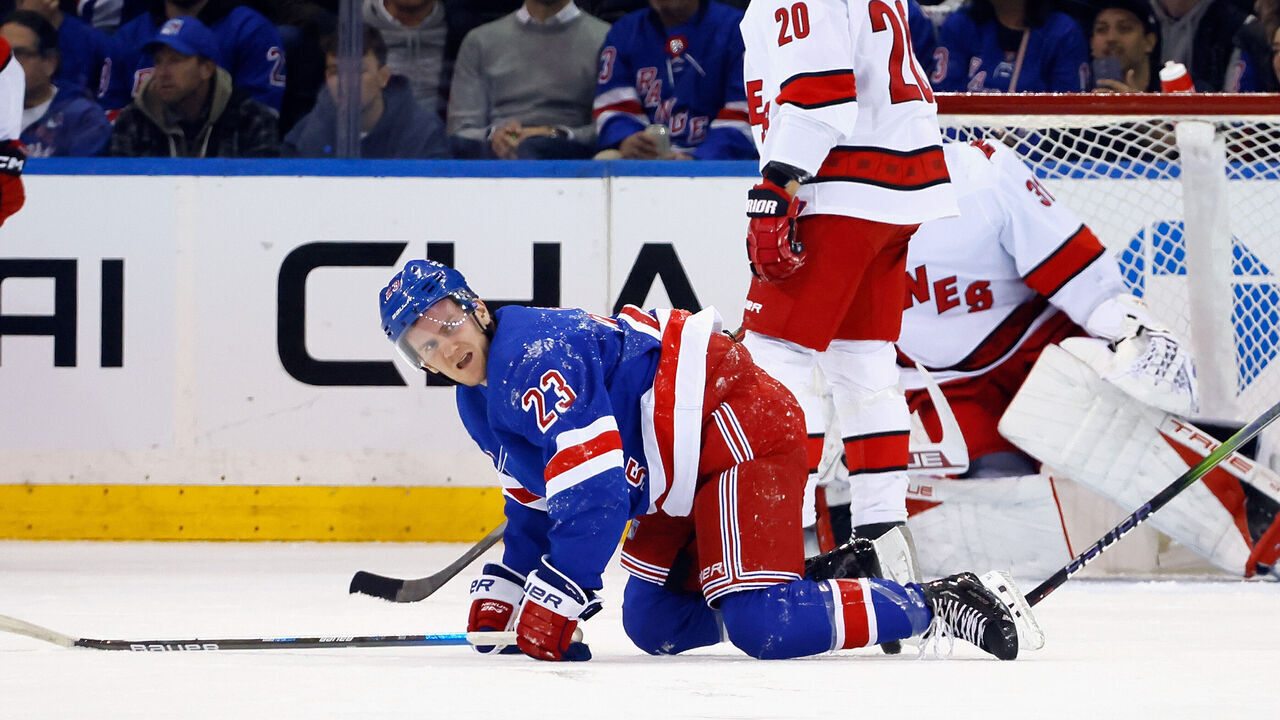 NEW YORK, NEW YORK - NOVEMBER 02: Adam Fox #23 of the New York Rangers is injured during the first period against Sebastian Aho #20 of the Carolina Hurricanes at Madison Square Garden on November 02, 2023 in New York City.