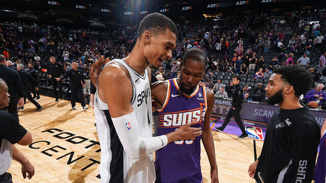 PHOENIX, AZ - NOVEMBER 2: Victor Wembanyama #1 of the San Antonio Spurs and Kevin Durant #35 of the Phoenix Suns talk after the game on November 2, 2023 at Footprint Center in Phoenix, Arizona. Mandatory Copyright Notice: Copyright 2023 NBAE