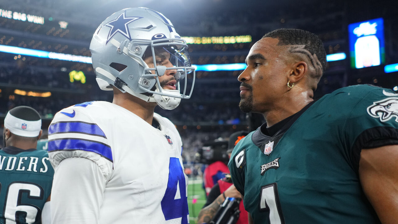 ARLINGTON, TEXAS - SEPTEMBER 27: Dak Prescott #4 of the Dallas Cowboys speaks with Jalen Hurts #1 of the Philadelphia Eagles after an NFL game at AT&T Stadium on September 27, 2021 in Arlington, Texas.