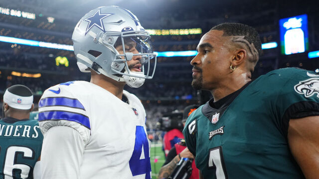 ARLINGTON, TEXAS - SEPTEMBER 27: Dak Prescott #4 of the Dallas Cowboys speaks with Jalen Hurts #1 of the Philadelphia Eagles after an NFL game at AT&T Stadium on September 27, 2021 in Arlington, Texas.