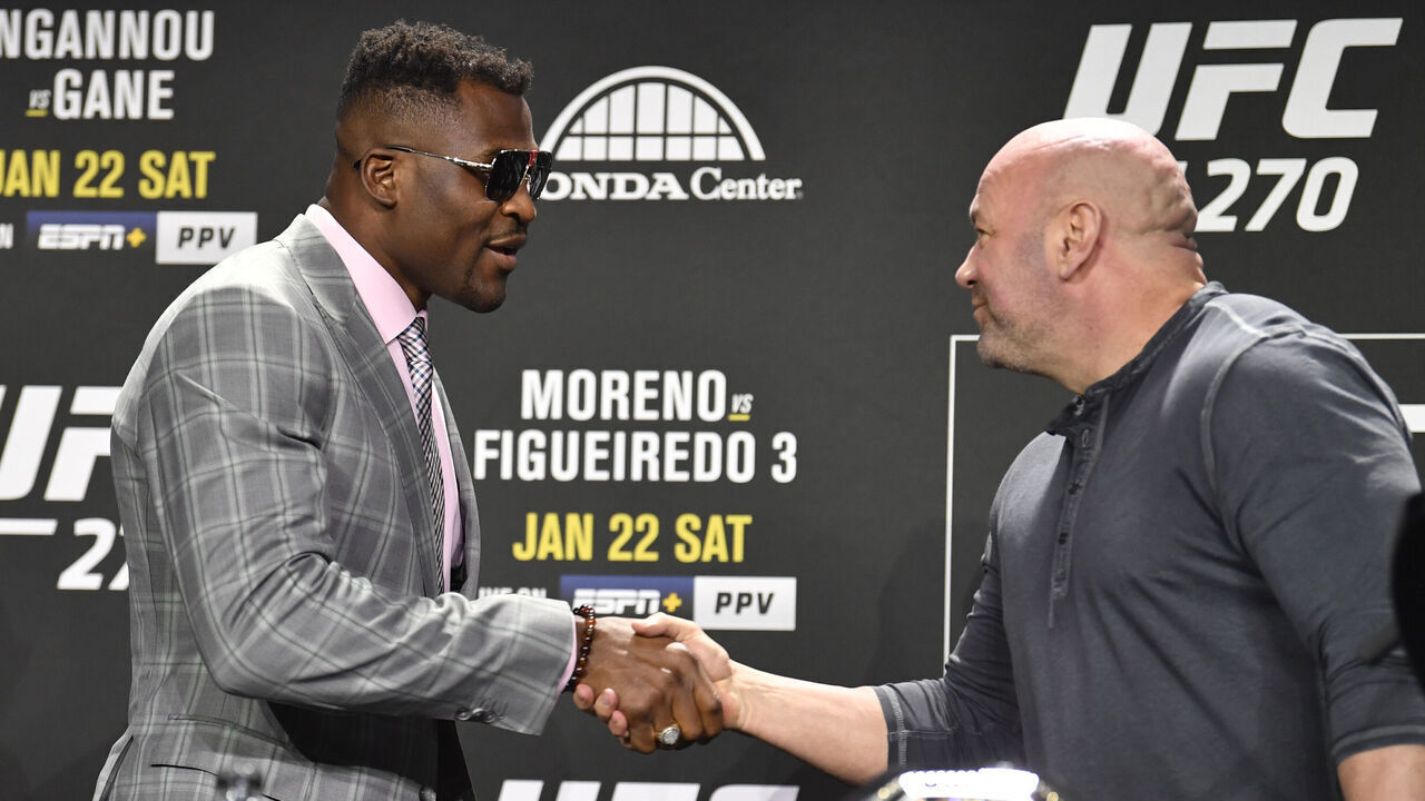ANAHEIM, CALIFORNIA - JANUARY 20: Francis Ngannou of Cameroon shakes hands with UFC president Dana White during the UFC 270 press conference at the Anaheim Convention Center on January 20, 2022 in Anaheim, California.
