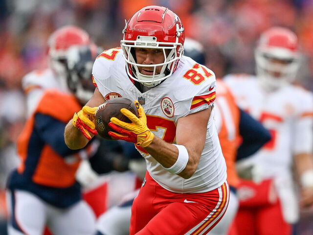 DENVER, CO - OCTOBER 29: Kansas City Chiefs tight end Travis Kelce (87) runs after a catch in the first half during a game between the Kansas City Chiefs and the Denver Broncos at Empower Field at Mile High on October 29, 2023 in Denver, Colorado.