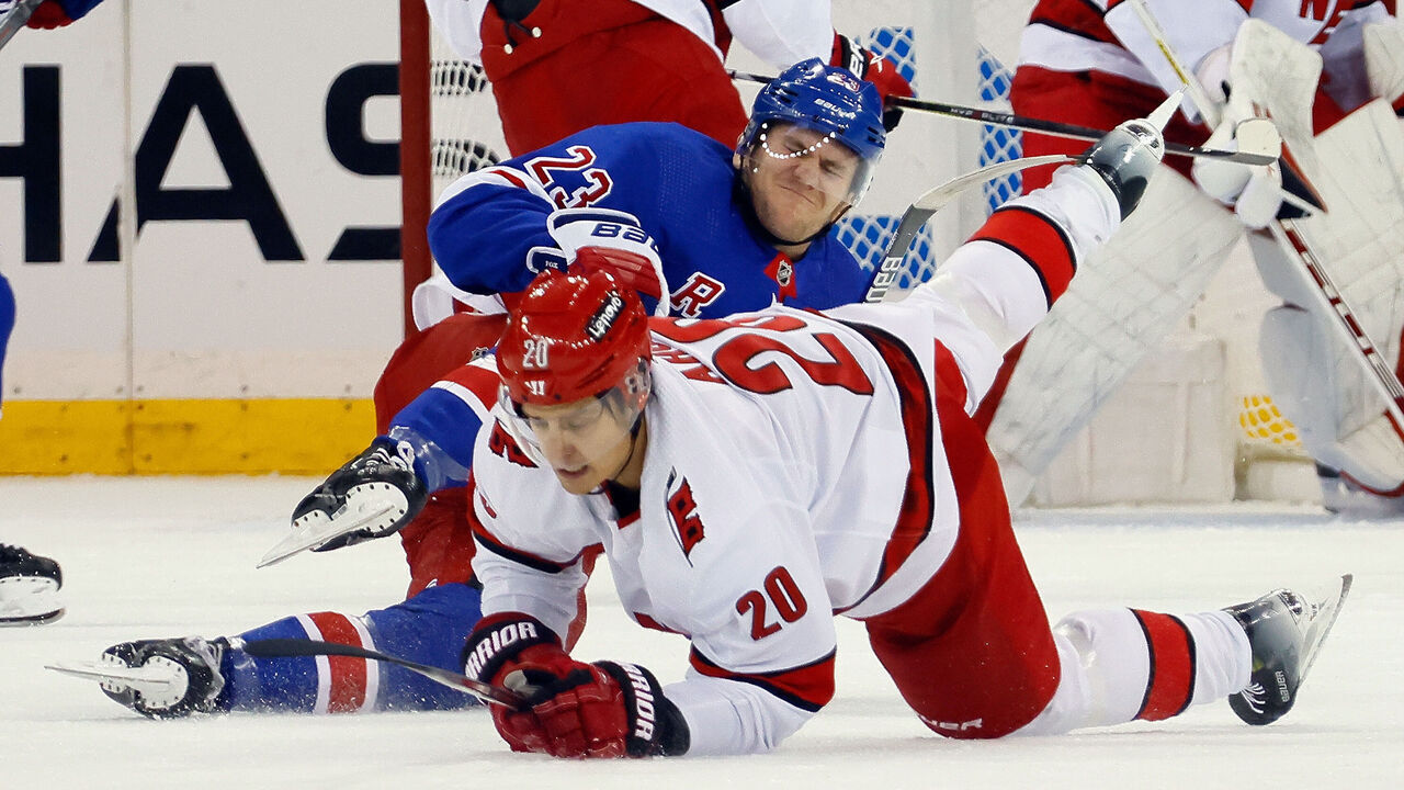 NEW YORK, NEW YORK - NOVEMBER 02: Adam Fox #23 of the New York Rangers is injured during the first period against Sebastian Aho #20 of the Carolina Hurricanes at Madison Square Garden on November 02, 2023 in New York City.