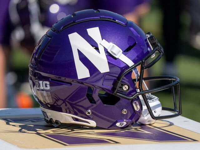 EVANSTON, IL - SEPTEMBER 30: a Northwestern Wildcats football helmet bearing the Northwestern Wildcats logo sits on a trainer's box during the college football game between the Penn State Nittany Lions and the Northwestern Wildcats on September 30, 2023 at Ryan Field in Evanston, IL.