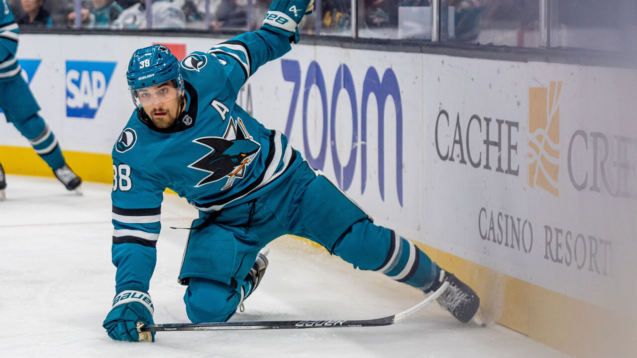 SAN JOSE, CA - NOVEMBER 02: San Jose Sharks defenseman Mario Ferraro (38) chases down the puck during the NHL professional men's hockey game between the Vancouver Canucks and San Jose Sharks on November 2, 2023 at the SAP Center in San Jose, CA.