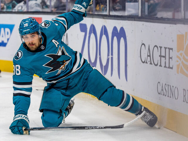 SAN JOSE, CA - NOVEMBER 02: San Jose Sharks defenseman Mario Ferraro (38) chases down the puck during the NHL professional men's hockey game between the Vancouver Canucks and San Jose Sharks on November 2, 2023 at the SAP Center in San Jose, CA.