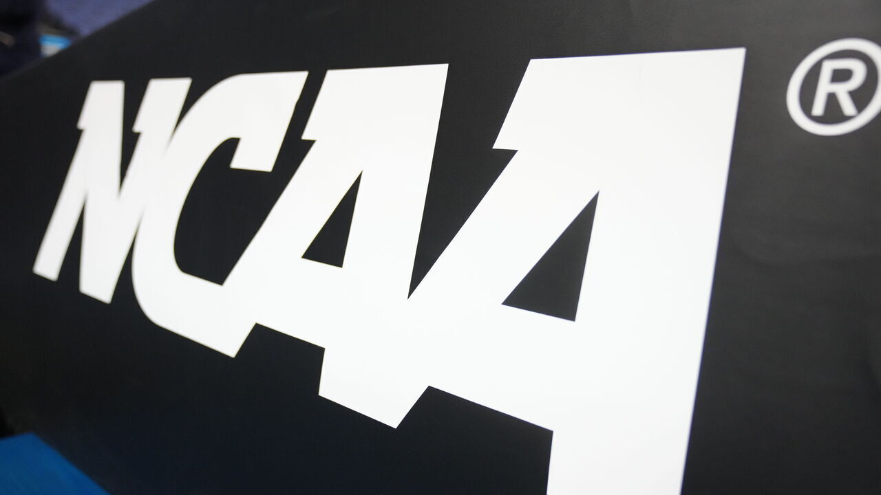 GREENSBORO, NORTH CAROLINA - MARCH 19: The NCAA logo on basketball pad before the second round of the 2023 NCAA Men's Basketball Tournament game between the Xavier Musketeers and the Pittsburgh Panthers at Greensboro Coliseum on March 19, 2023 in Greensboro, North Carolina.