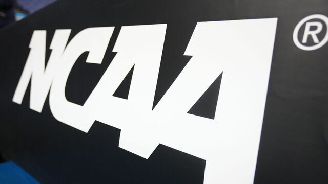 GREENSBORO, NORTH CAROLINA - MARCH 19: The NCAA logo on basketball pad before the second round of the 2023 NCAA Men's Basketball Tournament game between the Xavier Musketeers and the Pittsburgh Panthers at Greensboro Coliseum on March 19, 2023 in Greensboro, North Carolina.