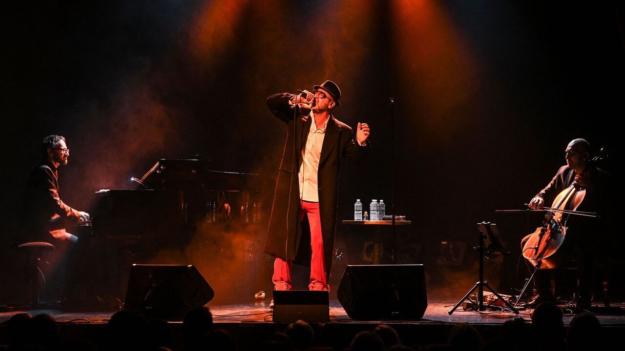 Former French football player and actor Eric Cantona performs at the Comedie Odeon Theatre in Lyon central-eastern France, on November 3, 2023. After football, cinema and painting, Eric Cantona, former Manchester United's star and player, starts a new tour to share his "emotions", between "dark and bright"