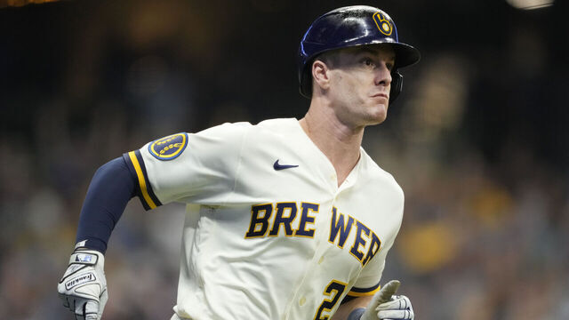 MILWAUKEE, WISCONSIN - OCTOBER 04: Mark Canha #21 of the Milwaukee Brewers hits an RBI single during the eighth inning against the Arizona Diamondbacks in Game Two of the Wild Card Series at American Family Field on October 04, 2023 in Milwaukee, Wisconsin.
