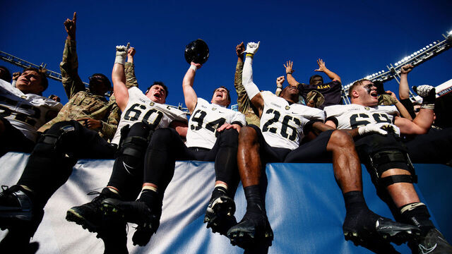DENVER, CO - NOVEMBER 4: The Army Black Knights players celebrate their win against the Air Force Falcons at Empower Field at Mile High on November 4, 2023 in Denver, Colorado. Army defeated Air Force 23-3.