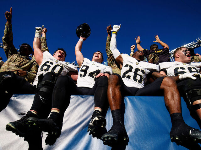DENVER, CO - NOVEMBER 4: The Army Black Knights players celebrate their win against the Air Force Falcons at Empower Field at Mile High on November 4, 2023 in Denver, Colorado. Army defeated Air Force 23-3.