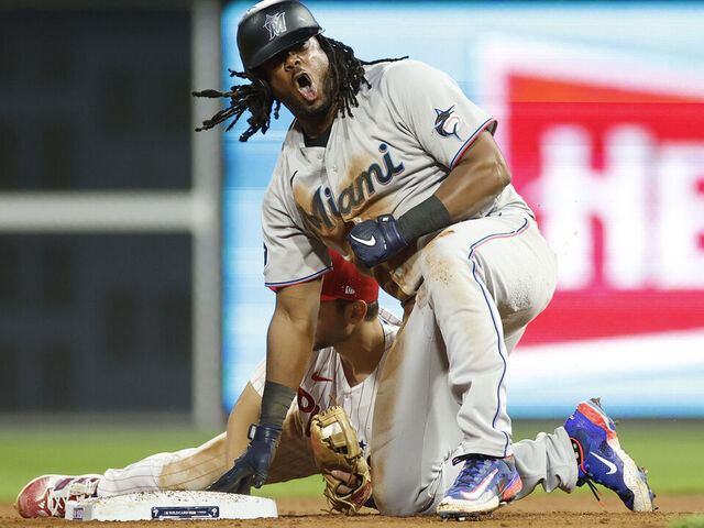 PHILADELPHIA, PENNSYLVANIA - OCTOBER 03: Josh Bell #9 of the Miami Marlins reacts after hitting a double during the ninth inning against the Philadelphia Phillies in Game One of the Wild Card Series at Citizens Bank Park on October 03, 2023 in Philadelphia, Pennsylvania.
