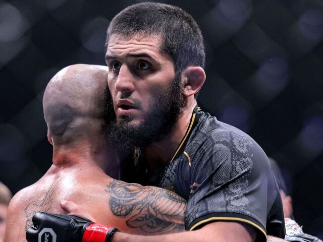 Russia's Islam Makhachev (R) embraces Australia's Alexander Volkanovski after their Lightweight bout during the Ultimate Fighting Championship 294 (UFC) event at the Etihad Arena in Abu Dhabi on October 22, 2023.