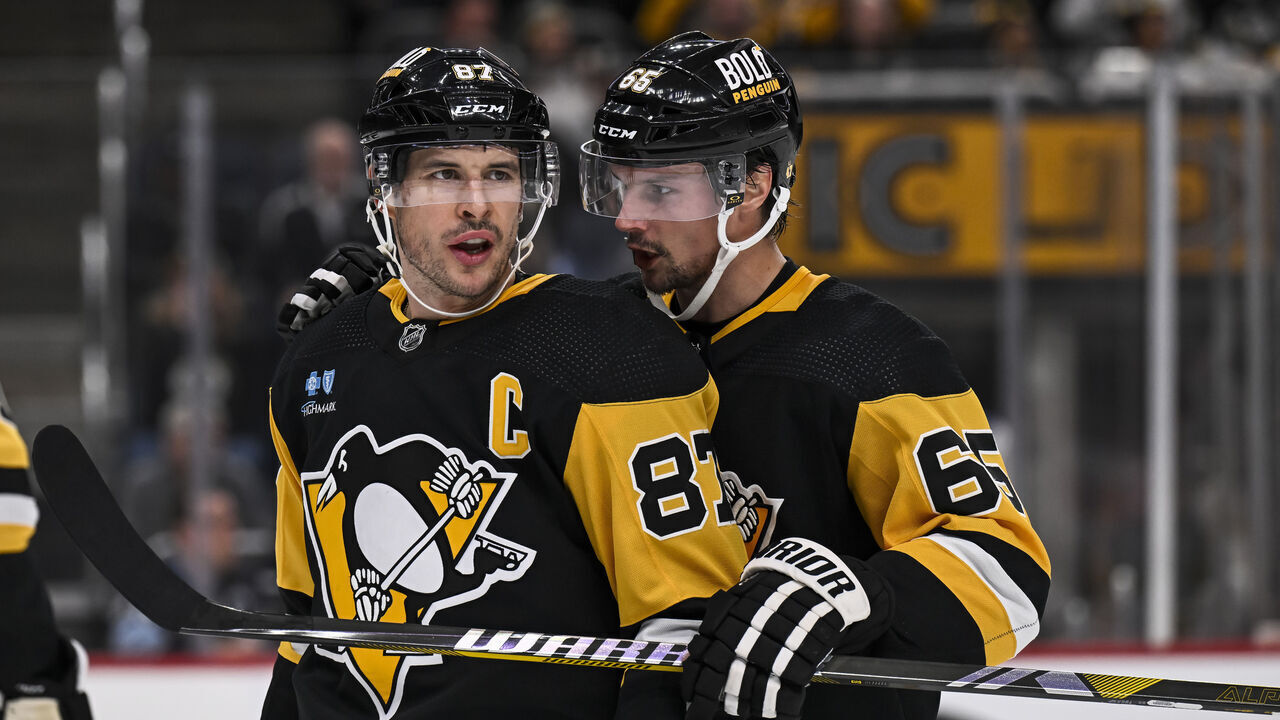 PITTSBURGH, PA - OCTOBER 30:Pittsburgh Penguins defenseman Erik Karlsson (65) talks to Pittsburgh Penguins center Sidney Crosby (87) during a break in the second period in the NHL game between the Pittsburgh Penguins and the Anaheim Ducks on October 30, 2023, at PPG Paints Arena in Pittsburgh, PA.