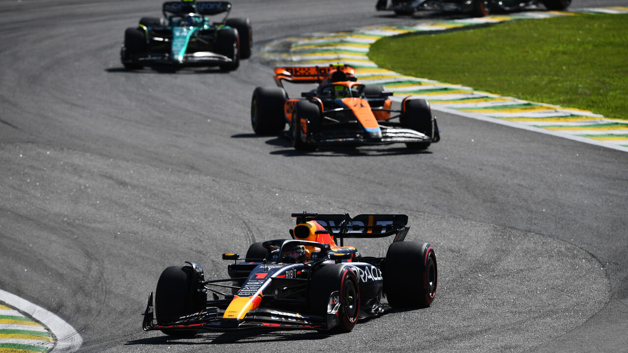 SAO PAULO, BRAZIL - NOVEMBER 05: Max Verstappen of the Netherlands driving the (1) Oracle Red Bull Racing RB19 leads Lando Norris of Great Britain driving the (4) McLaren MCL60 Mercedes on track during the F1 Grand Prix of Brazil at Autodromo Jose Carlos Pace on November 05, 2023 in Sao Paulo, Brazil.
