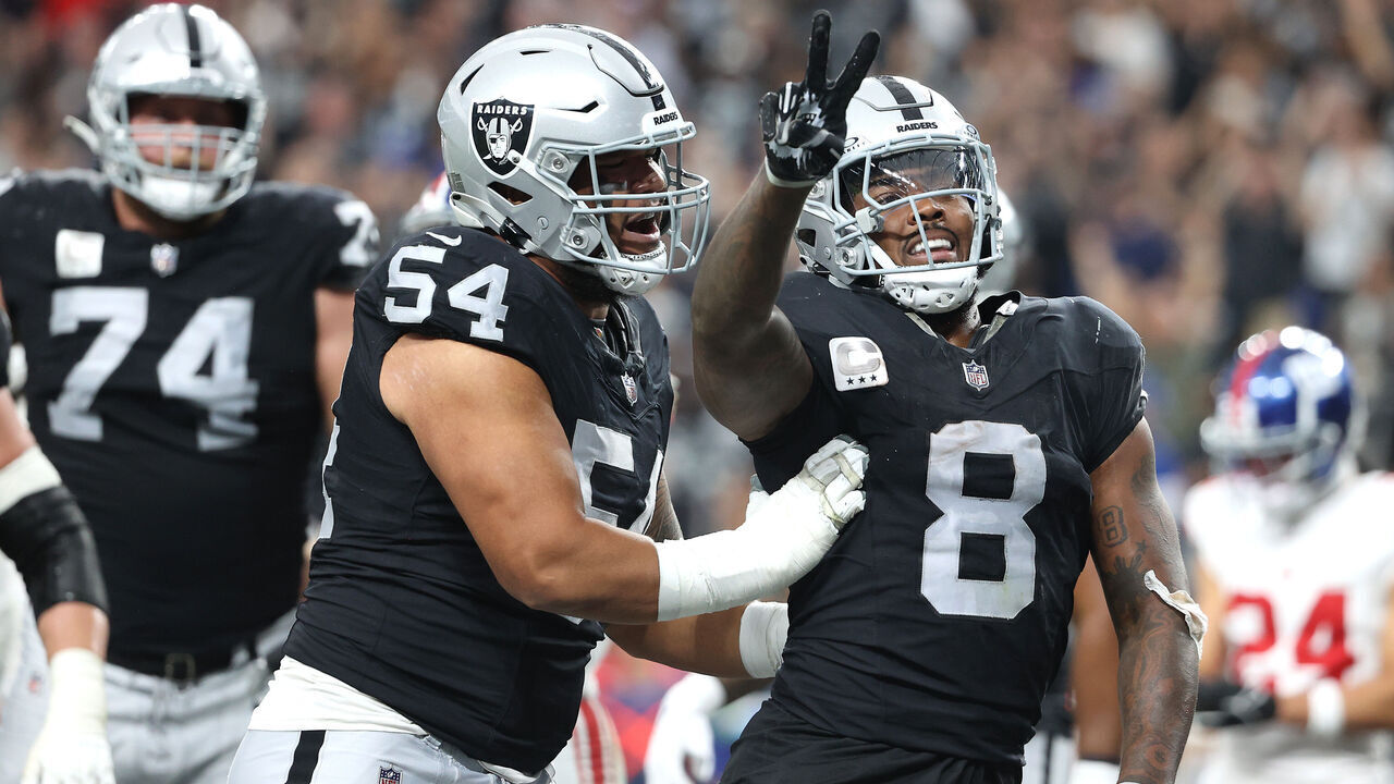 LAS VEGAS, NEVADA - NOVEMBER 05: Josh Jacobs #8 of the Las Vegas Raiders celebrates with Netane Muti #54 after a touchdown in the second quarter of a game against the New York Giants at Allegiant Stadium on November 05, 2023 in Las Vegas, Nevada.