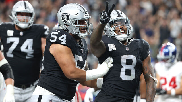 LAS VEGAS, NEVADA - NOVEMBER 05: Josh Jacobs #8 of the Las Vegas Raiders celebrates with Netane Muti #54 after a touchdown in the second quarter of a game against the New York Giants at Allegiant Stadium on November 05, 2023 in Las Vegas, Nevada.
