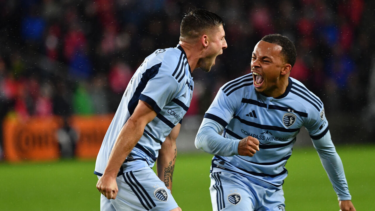 ST. LOUIS, MO - OCTOBER 29: Remi Walter #54 (L) and Logan Ndenbe #18 of Sporting Kansas City celebrate a goal during game One of the First Round of Playoffs between Sporting Kansas City and St. Louis City SC at CITYPARK on October 29, 2023 in St. Louis, Missouri.