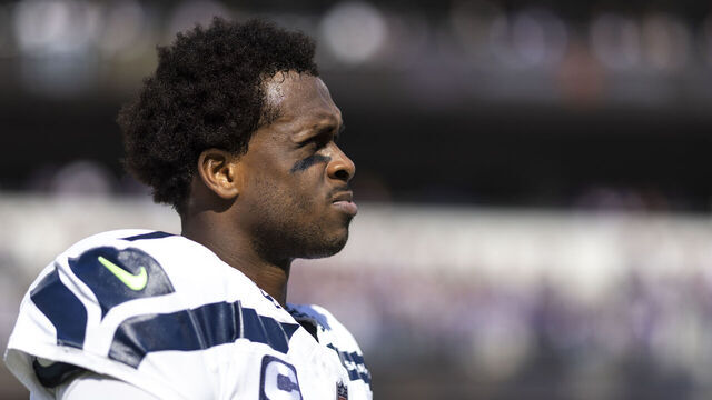 BALTIMORE, MARYLAND - NOVEMBER 05: Geno Smith #7 of the Seattle Seahawks looks on during the national anthem prior to an NFL football game between the Baltimore Ravens and the Seattle Seahawks at M&T Bank Stadium on November 05, 2023 in Baltimore, Maryland.