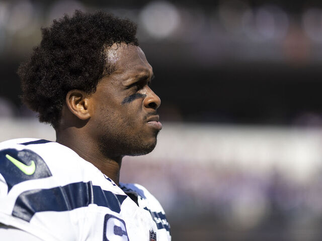 BALTIMORE, MARYLAND - NOVEMBER 05: Geno Smith #7 of the Seattle Seahawks looks on during the national anthem prior to an NFL football game between the Baltimore Ravens and the Seattle Seahawks at M&T Bank Stadium on November 05, 2023 in Baltimore, Maryland.