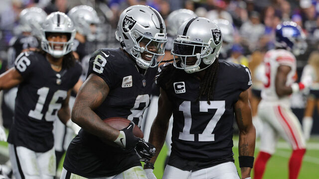LAS VEGAS, NEVADA - NOVEMBER 05: Josh Jacobs #8 of the Las Vegas Raiders celebrates with Davante Adams #17 after scoring a touchdown in the second quarter of a game against the New York Giants at Allegiant Stadium on November 05, 2023 in Las Vegas, Nevada.