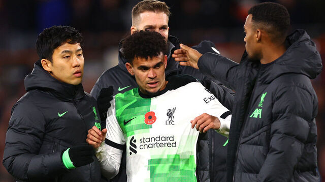 LUTON, ENGLAND - NOVEMBER 05: Luis Diaz of Liverpool is embraced by teammates at full-time following the Premier League match between Luton Town and Liverpool FC at Kenilworth Road on November 05, 2023 in Luton, England.