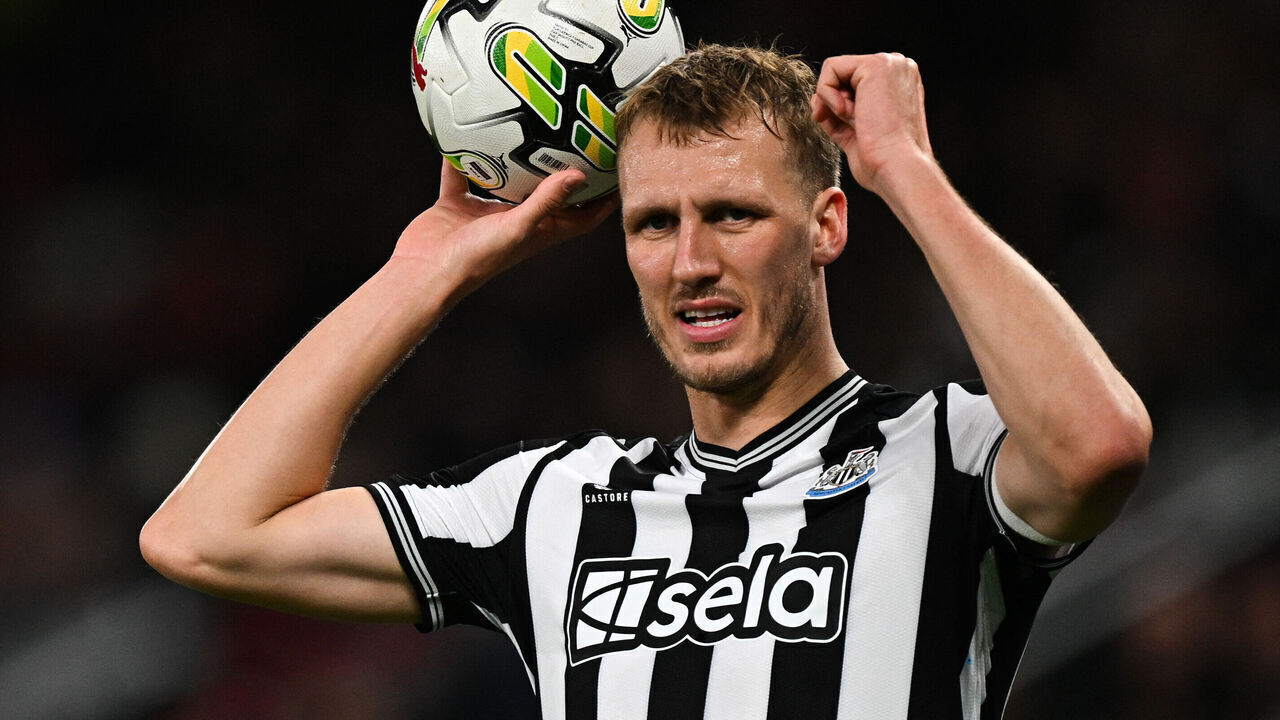 Newcastle United's English defender #33 Dan Burn prepares to throw the ball during the English League Cup fourth round football match between Manchester United and Newcastle United at Old Trafford, in Manchester, north west England, on November 1, 2023.